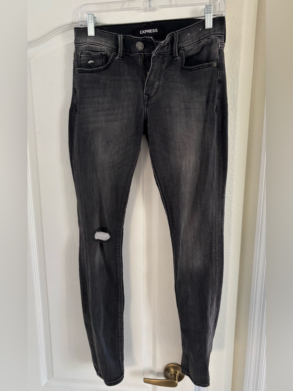 Express Women’s Black Skinny Jeans with Knee Distress. Size 2R